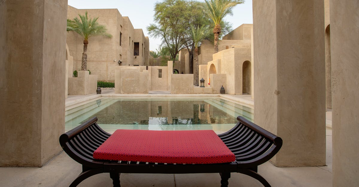 On transit Dubai - passport validity - Wooden Bench Near a Swimming Pool