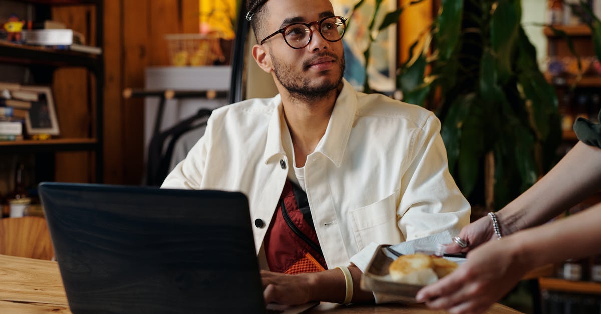 Online resource for finding cafes/wifi hotspots for working while traveling - Stylish Man in White Jacket and Eyeglasses 