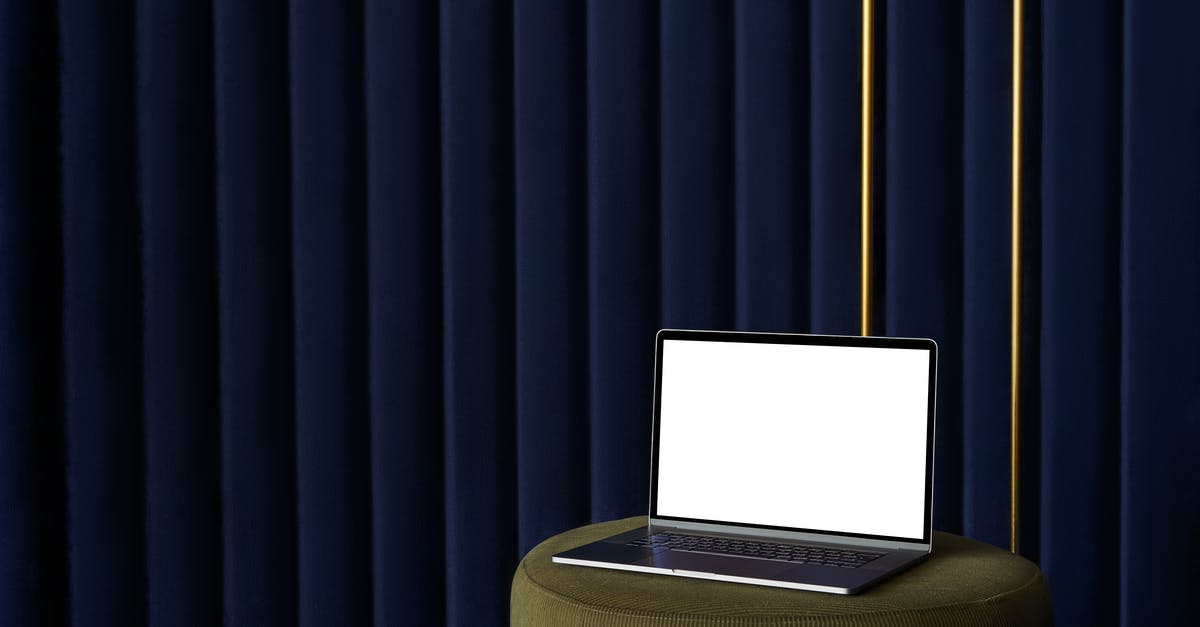 Online ticket benefits, Madame Tussauds New York - Laptop placed on pouf near curtain