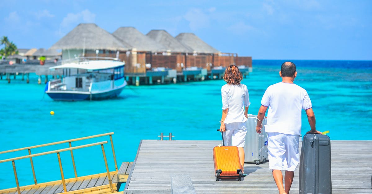 Online travel agent leaving and returning with different airlines - Man and Woman Walks on Dock