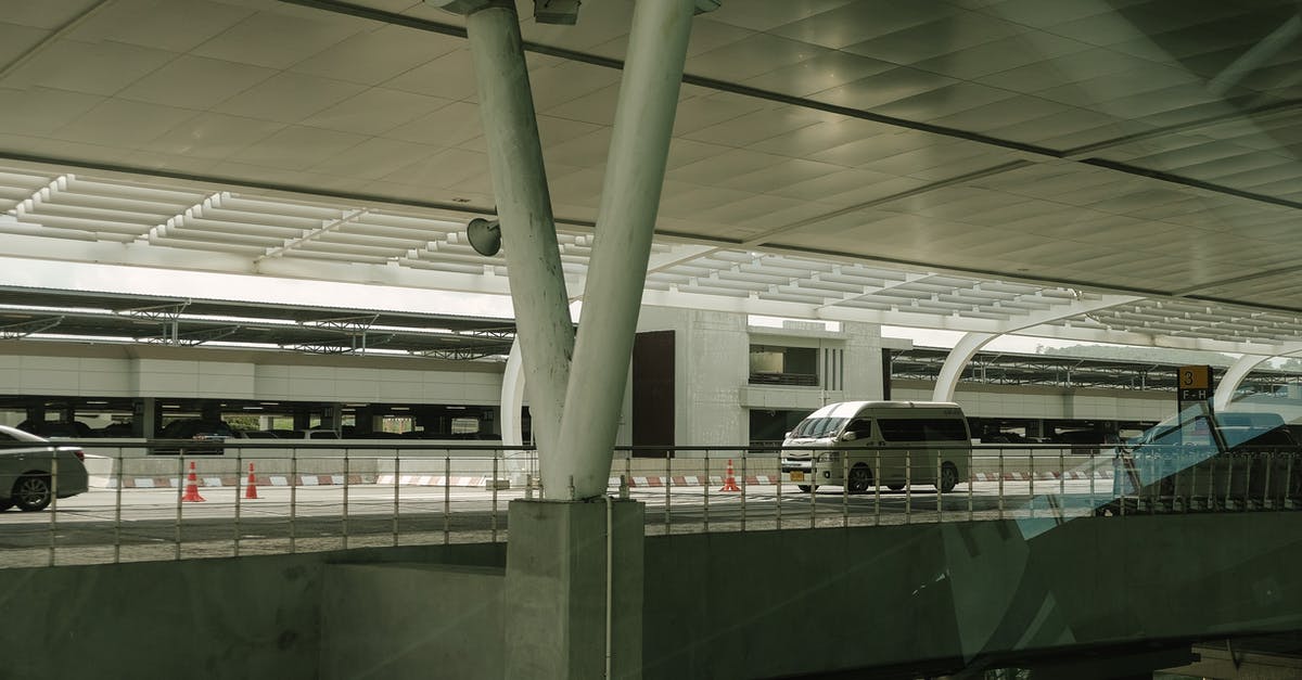 On-site rental cars at San Juan airport (SJU) - White Van in Road Near Buildings