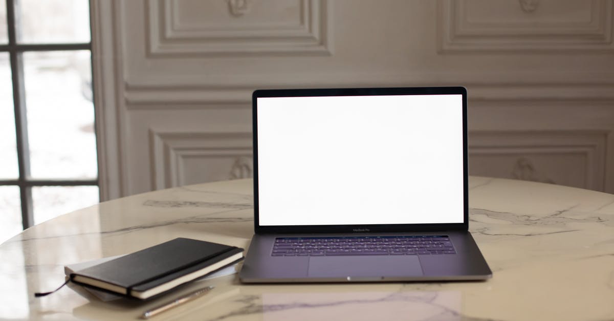 Open spillways at Itaipu Dam - Macbook Pro on White Table