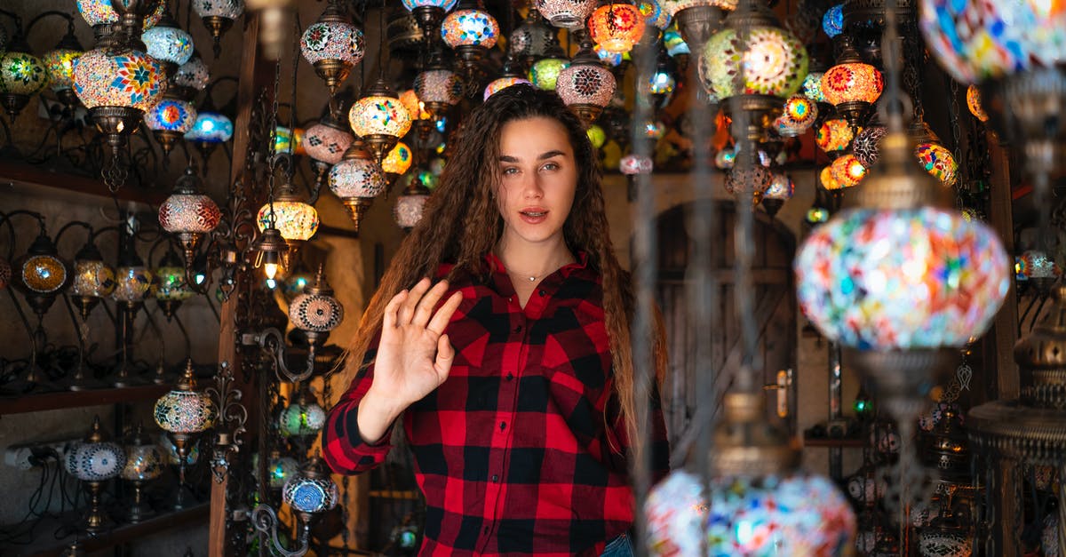 Options for getting from Kayseri (Turkey) to Goreme - Woman Surrounded by Mosaic Glass Lanterns