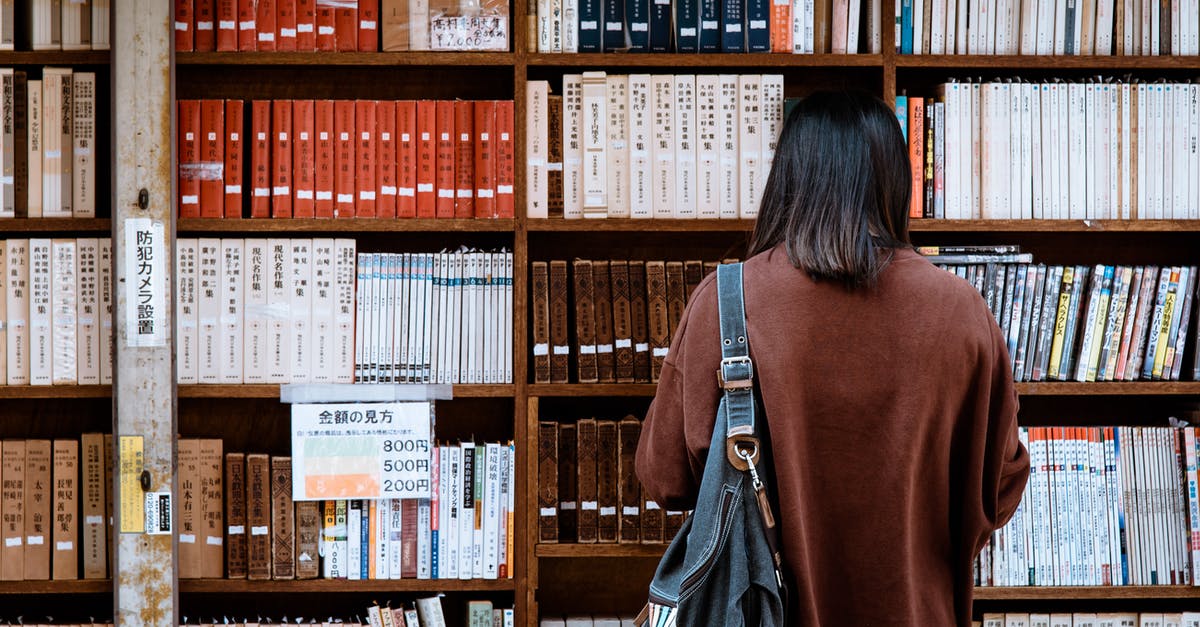 Order of obtaining visas - Woman Wearing Brown Shirt Carrying Black Leather Bag on Front of Library Books