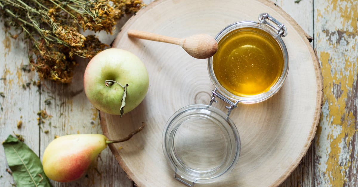 Organic Grocer in Tuscany? - Top View of a Jar of Honey and an Apple