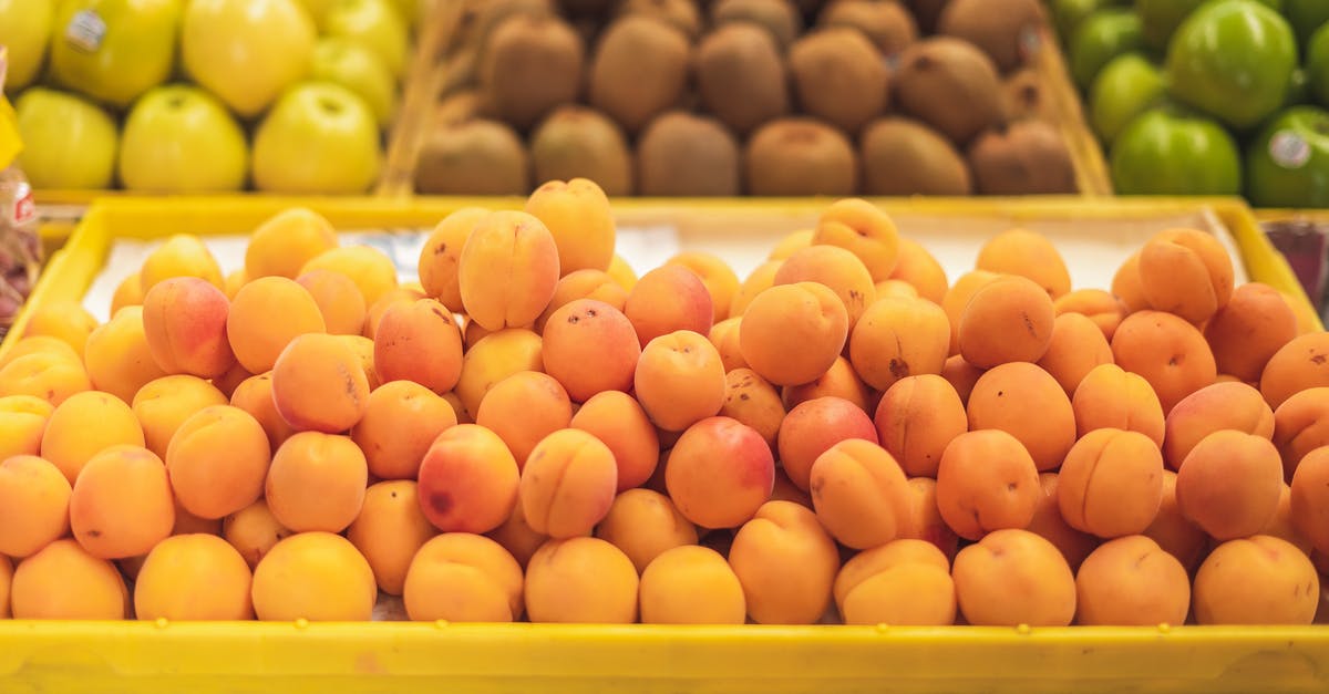 Organic Grocer in Tuscany? - Brown Round Fruits on Yellow Plastic Tray