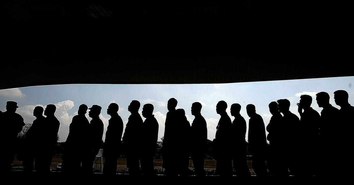 Other passports queue arriving in UK? - Group of Men Forming a Libe