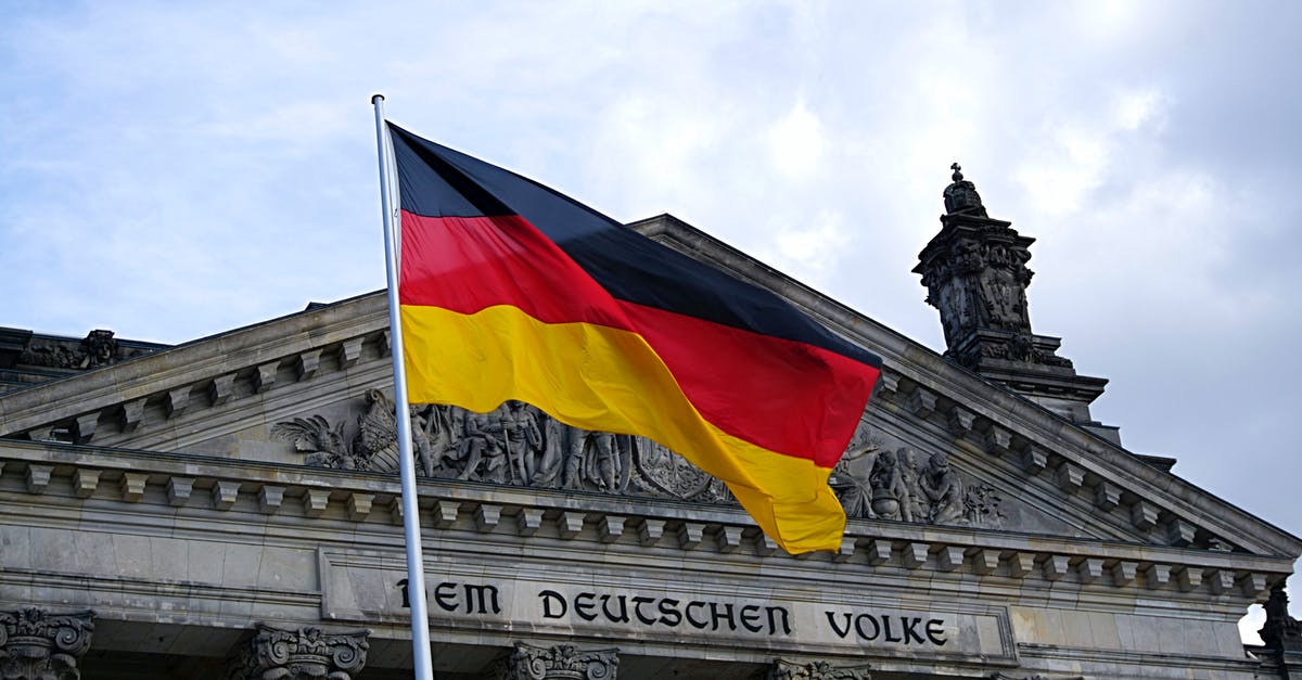 Overcrowded German trains - Germany Flag in Front of Building