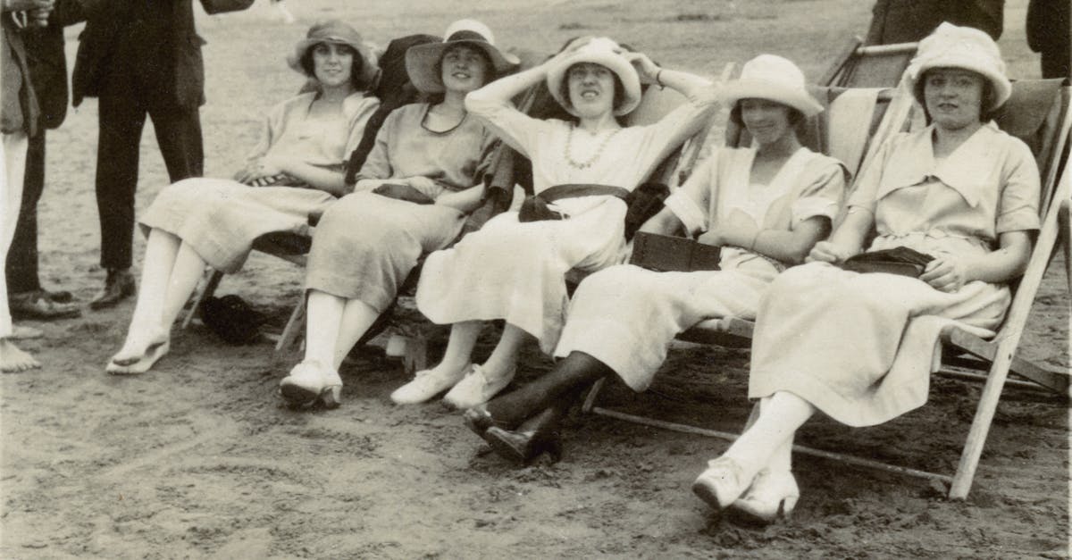 Overlapping periods of several Schengen visa [duplicate] - Grayscale Photo of  Women Sitting on A Folding Chair