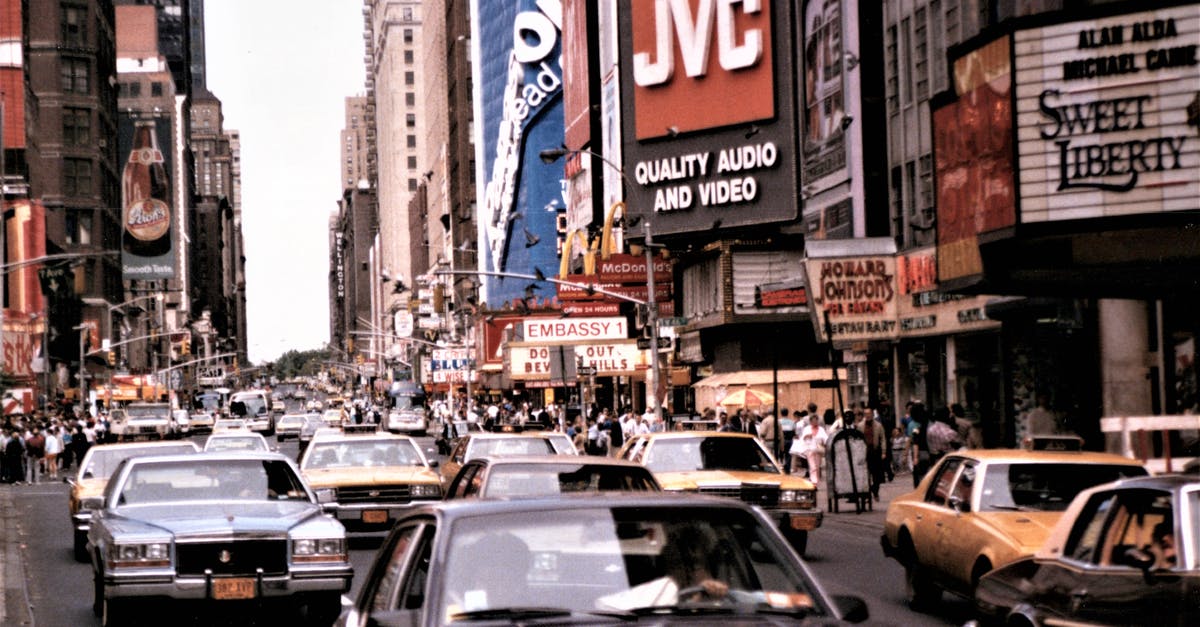 Overnight layover in New York airports - Cars on Road Near High Rise Buildings