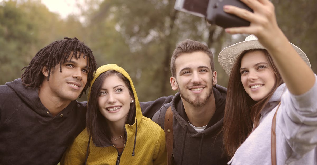 Overstayed in Canada for three months, will this affect student visa application to the UK? [closed] - Happy diverse friends taking selfie in park
