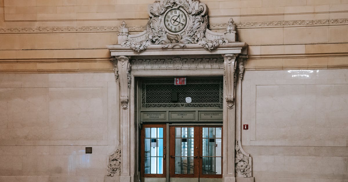 Overstayed in the Philippines for years: How to go back to the US without paying a big fine? - Richly decorated door with windows in spacious museum hall