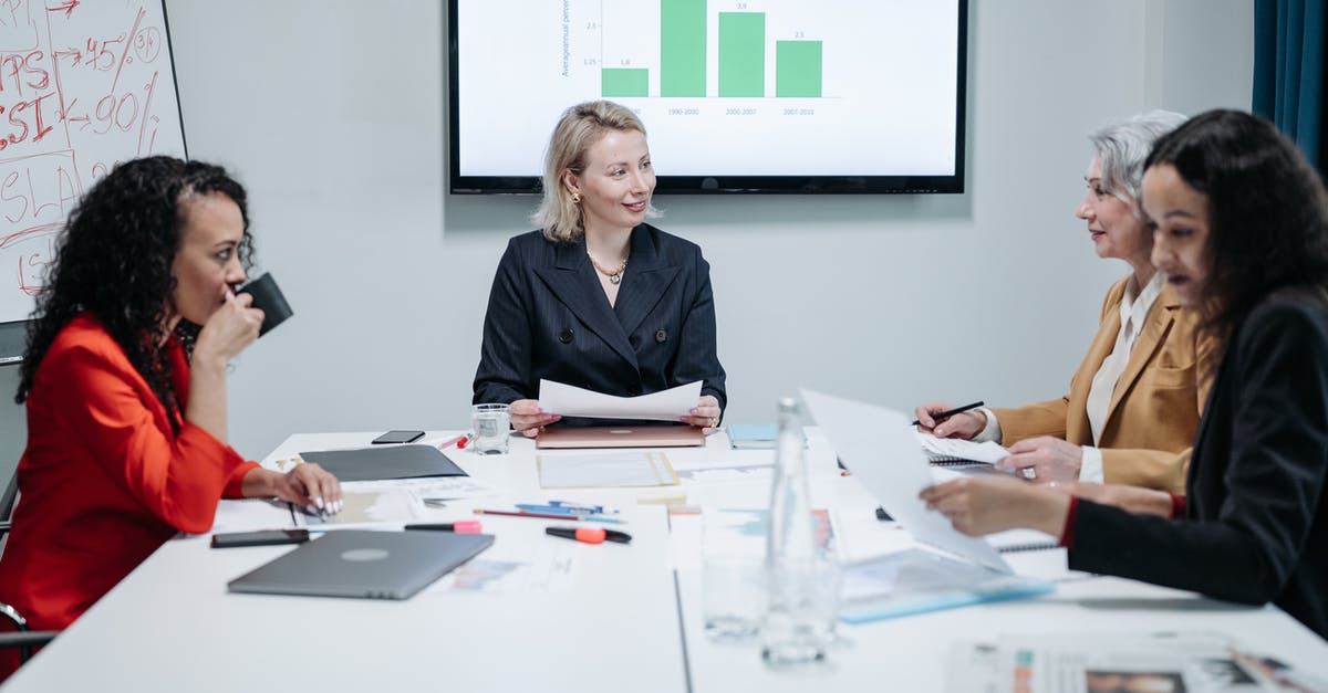 Overstaying and documents - Woman in Black Blazer Sitting at the Table