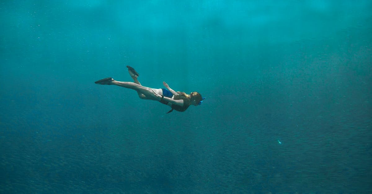 Overstaying In Philippines [duplicate] - Photo of Woman Swimming Underwater