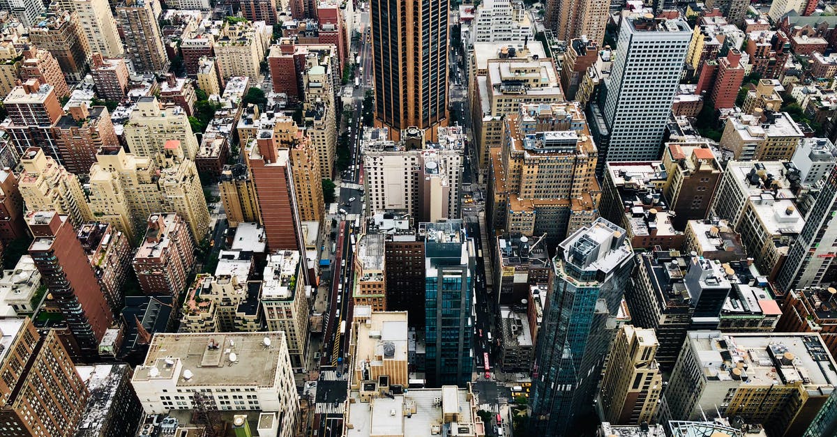 Overstaying in USA from Canada. What's the process passing immigration? - Aerial Photo of City Buildings