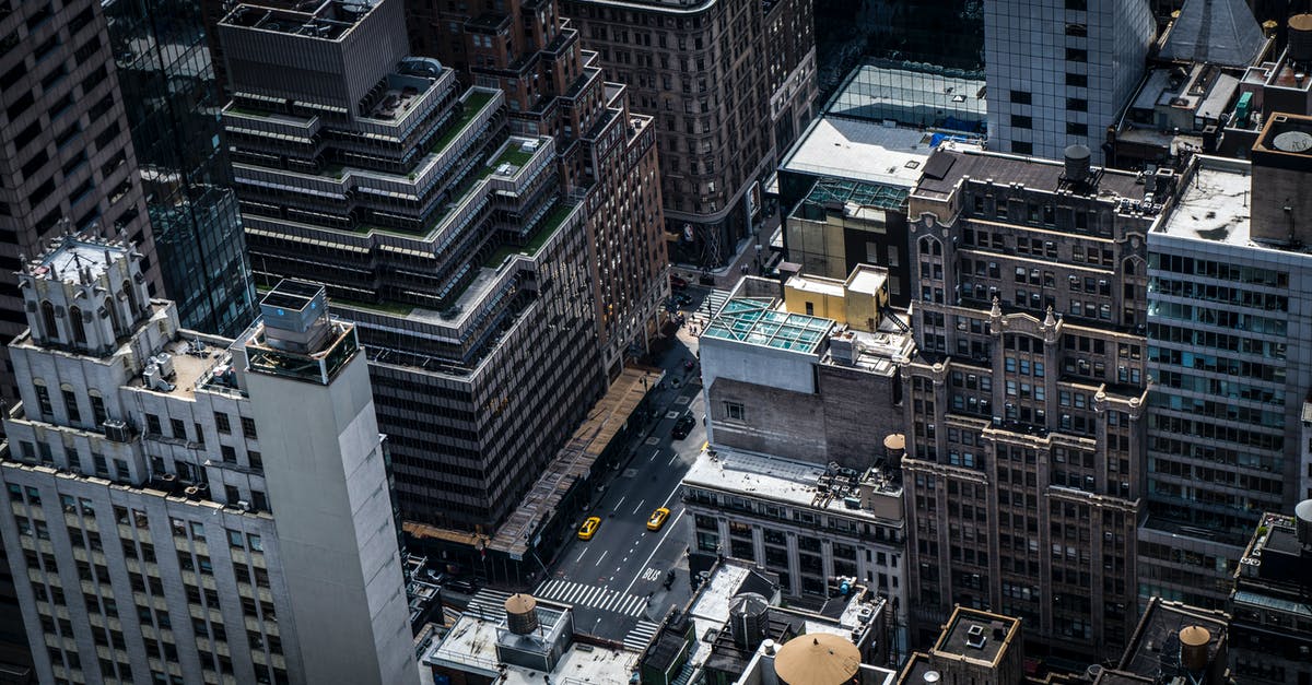 Overstaying in USA from Canada. What's the process passing immigration? - Aerial View Of City Buildings