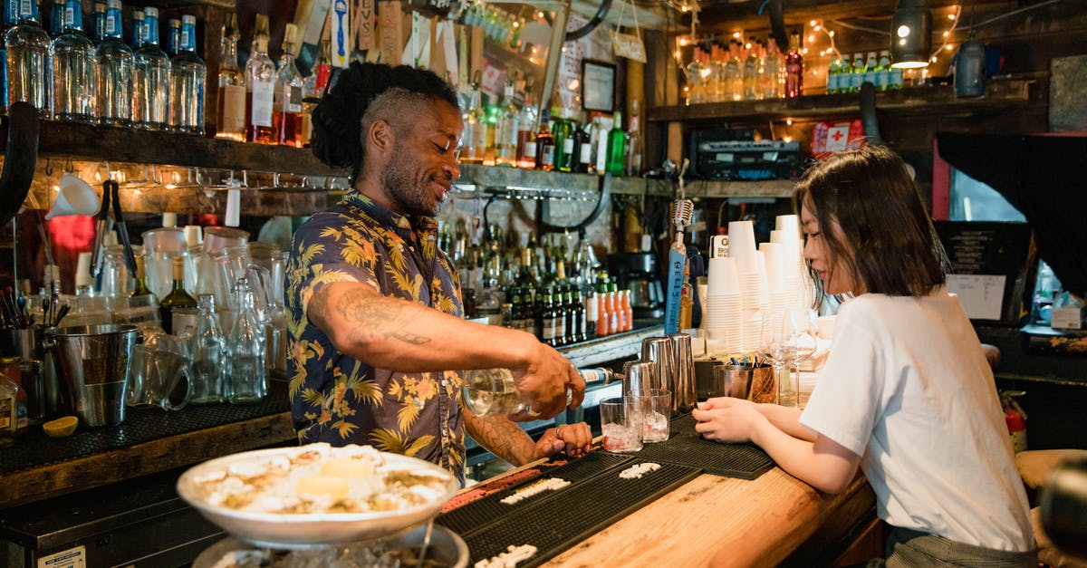 Oyster card—London only? - Bartender Preparing Cocktail for Customer at Bar