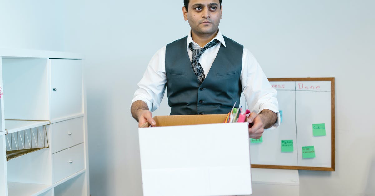 Packed Items at Indian Customs - Man Carrying a White Box