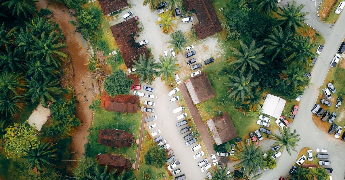 Paid parking on holiday in Czechia - Roofs of villas with parked cars in exotic resort