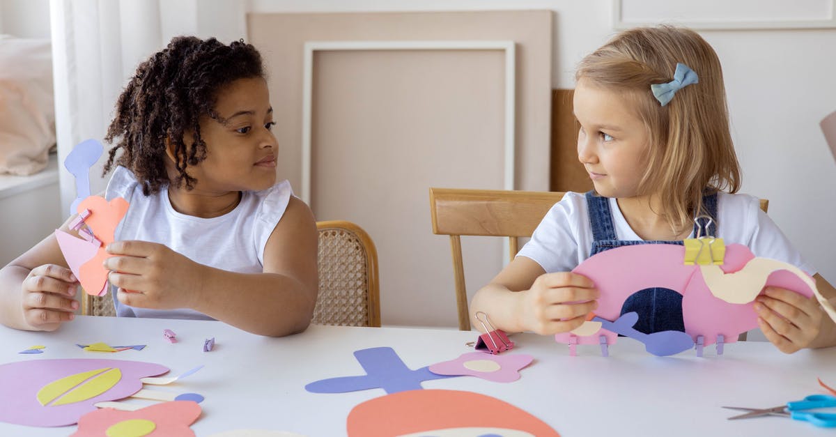 Parent-child; sit next to each other on an all-inclusive flight? - Two Kids Doing Some Artworks