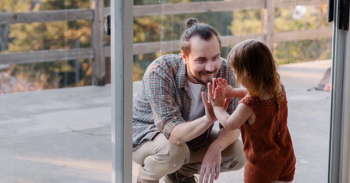 Parents name different on passport UK visa - Little daughter and father having fun together