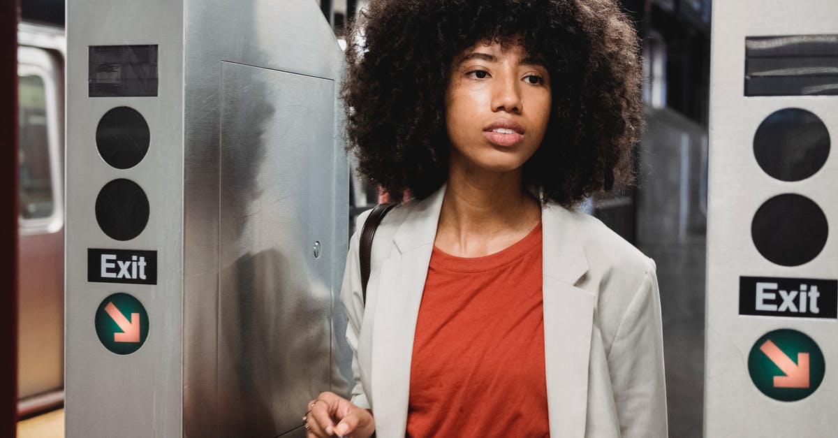 Paris CDG Arrival - Woman in White Blazer and Orange Shirt