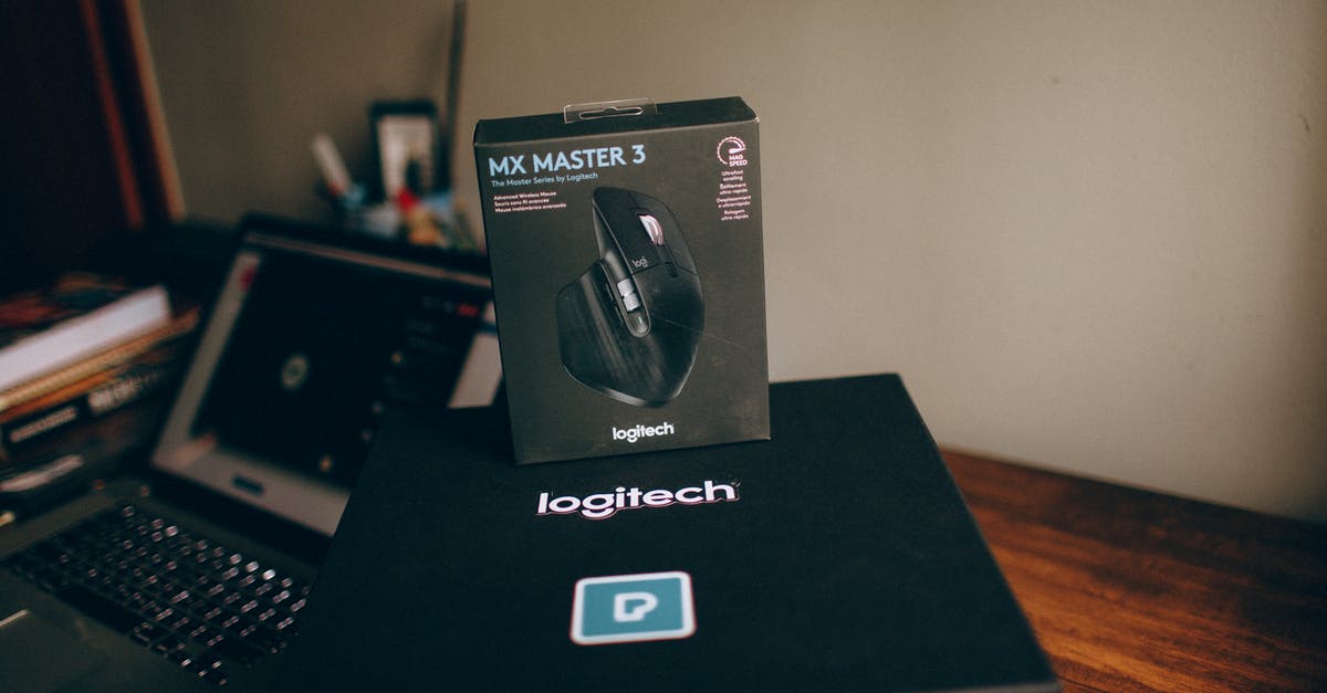 Passing through security at US airport with a brand new laptop - New Computer Mouse on Top of the Black Box Passing through security at US airport with a brand new laptop - New Computer Mouse on Top of the Black Box