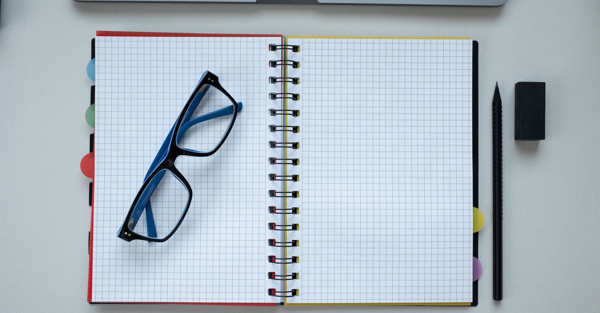 Passport blank page requirements for Kurdistan - Eyeglasses Lying on an Open Notebook 