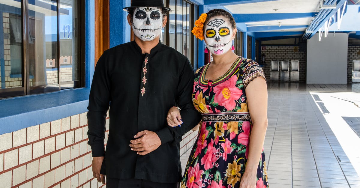 Passport stamped on arrival in Mexico, none departing Mexico - Man and Woman with Faces Painted for the Day of the Dead in Mexico