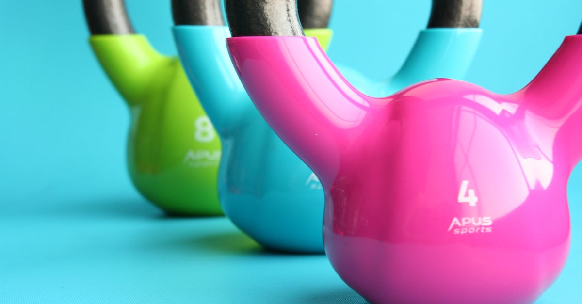 Passport Strength (with stamps and visas) [closed] - Green, Blue, and Pink Kettle Bells on Blue Surface