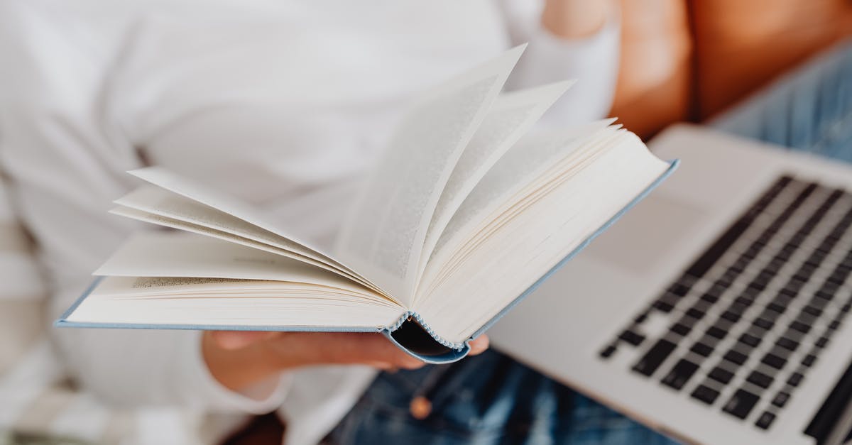 Passport with all pages full [closed] - Person in Blue Denim Jeans Reading Book