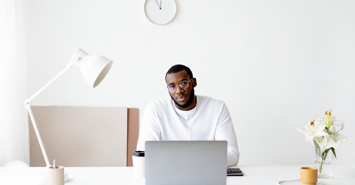 Paying a Brazil visa overstay fine upon reentry without paperwork - Photo Of Man Wearing White Sweater In Front Of Laptop