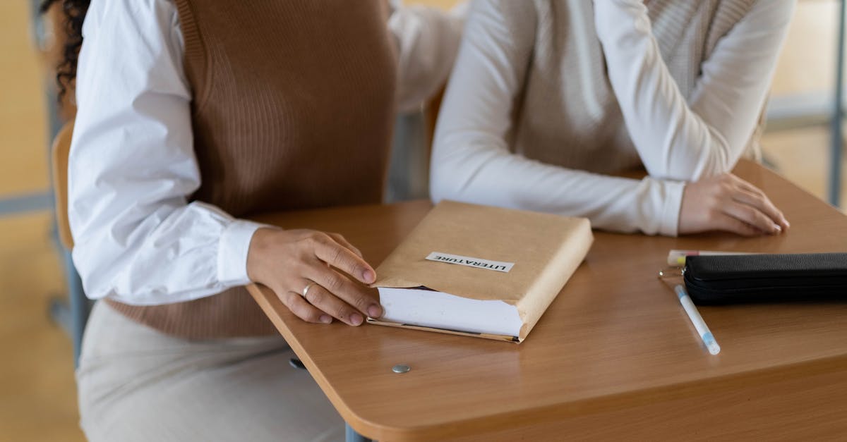 Permesso is not ready and student visa is expired - Woman in White Long Sleeve Shirt Holding White Tablet Computer