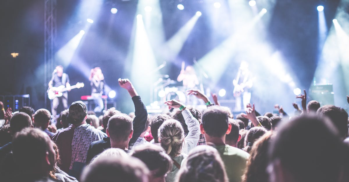 Per-route on-time performance for VIA rail - Crowd in Front of People Playing Musical Instrument during Nighttime