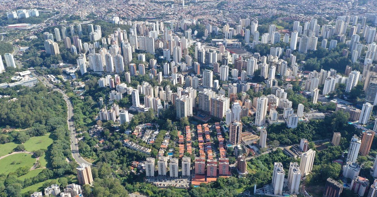 Peru: Can I reserve the hostels on the same day I arrive in a new city? - Drone view of spectacular developed city with tall houses and roads on sunny clear day