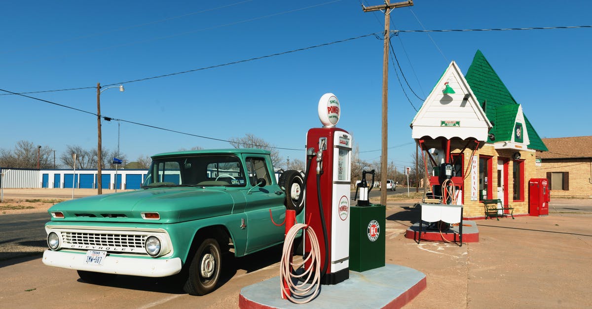 Petrol stations with free wifi in Iceland - Green Single-cab Pickup Truck Beside a Gas Pump Station