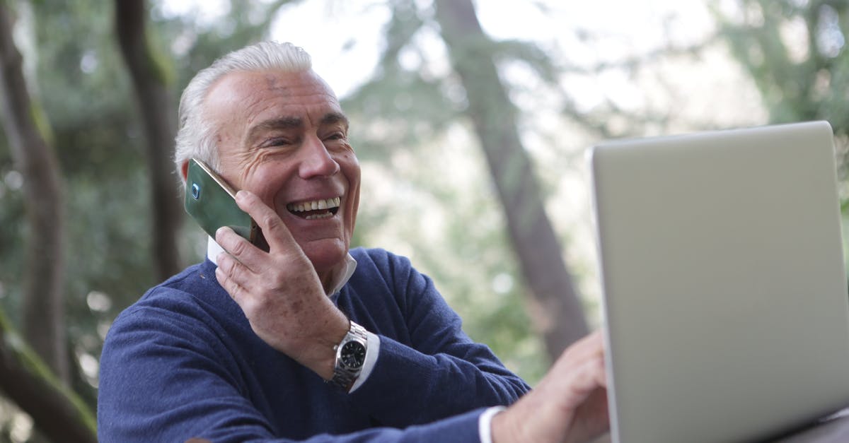 Phones for use in India [closed] - Man in Blue Long Sleeve Sweater Using Cellphone