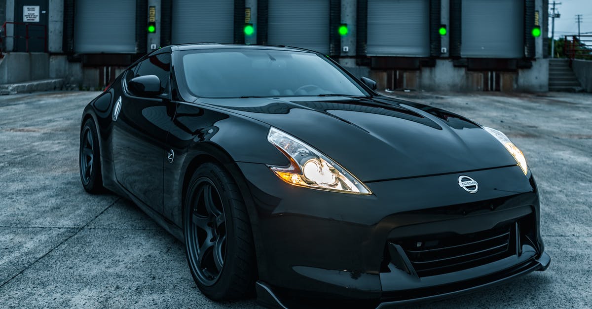 pick up rental car from Amtrak station in Schenectady NY? - Stylish shiny black sports car with tuning and glowing headlights parked on loading zone