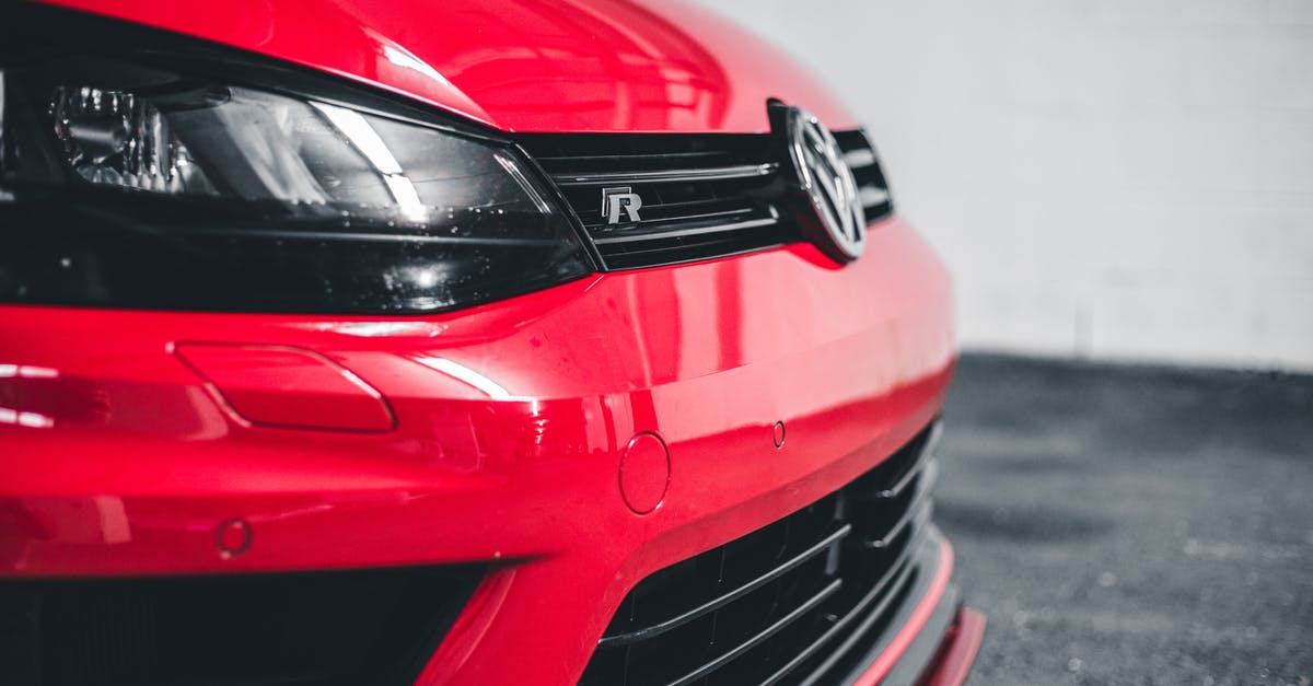 pick up rental car from Amtrak station in Schenectady NY? - Closeup of clean headlight of red tuned automobile parked in contemporary bright garage