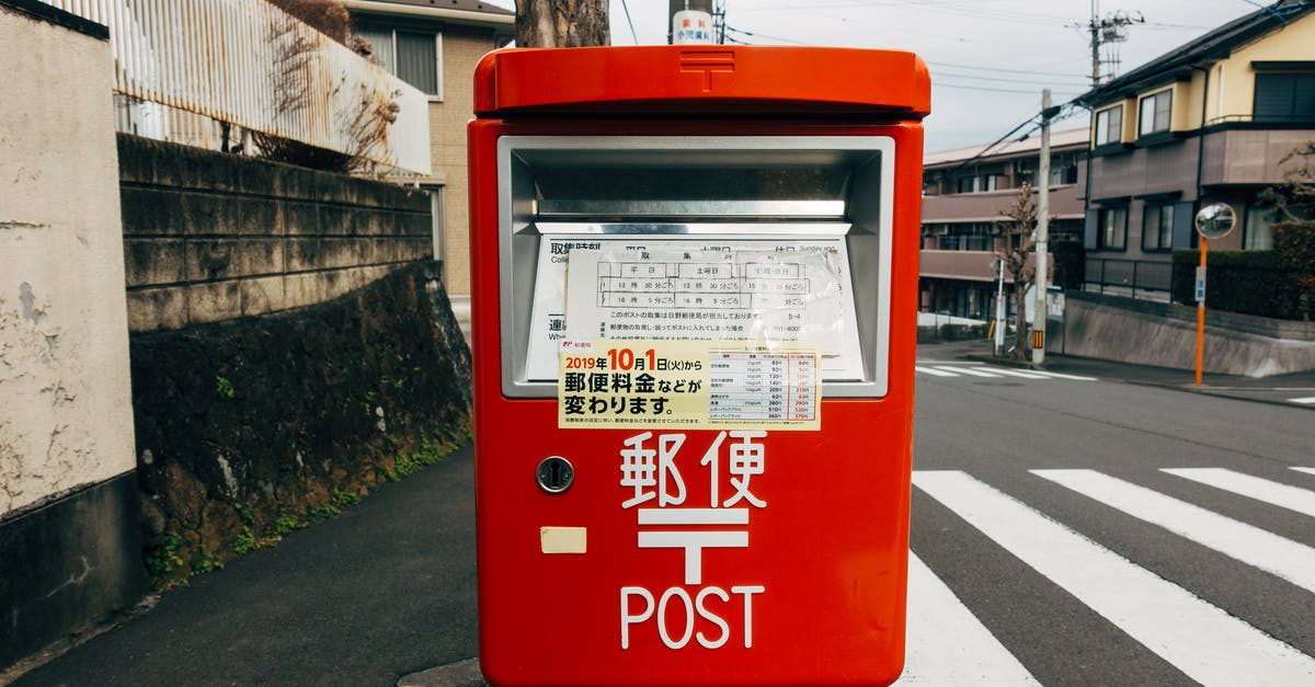 Picking up mail at the Post Office in Japan - Red and White Mail Box