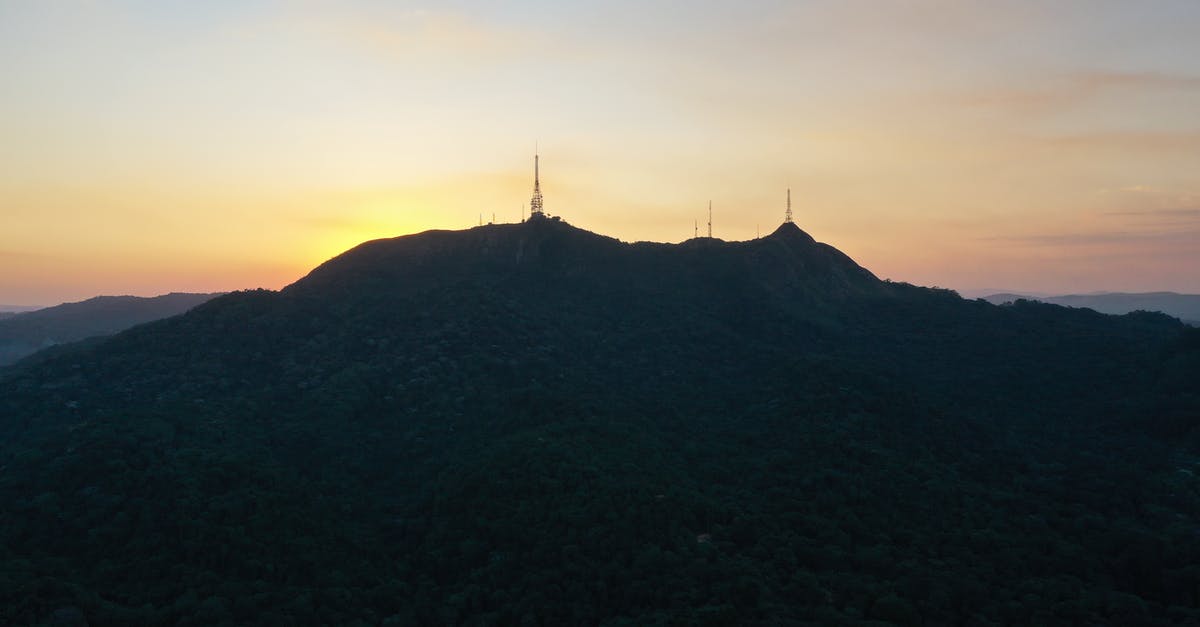 Pico de Aneto ascent - Picturesque scenery of silhouette of Pico do Jaragua mountain with TV towers located in Sao Paulo against sunset sky