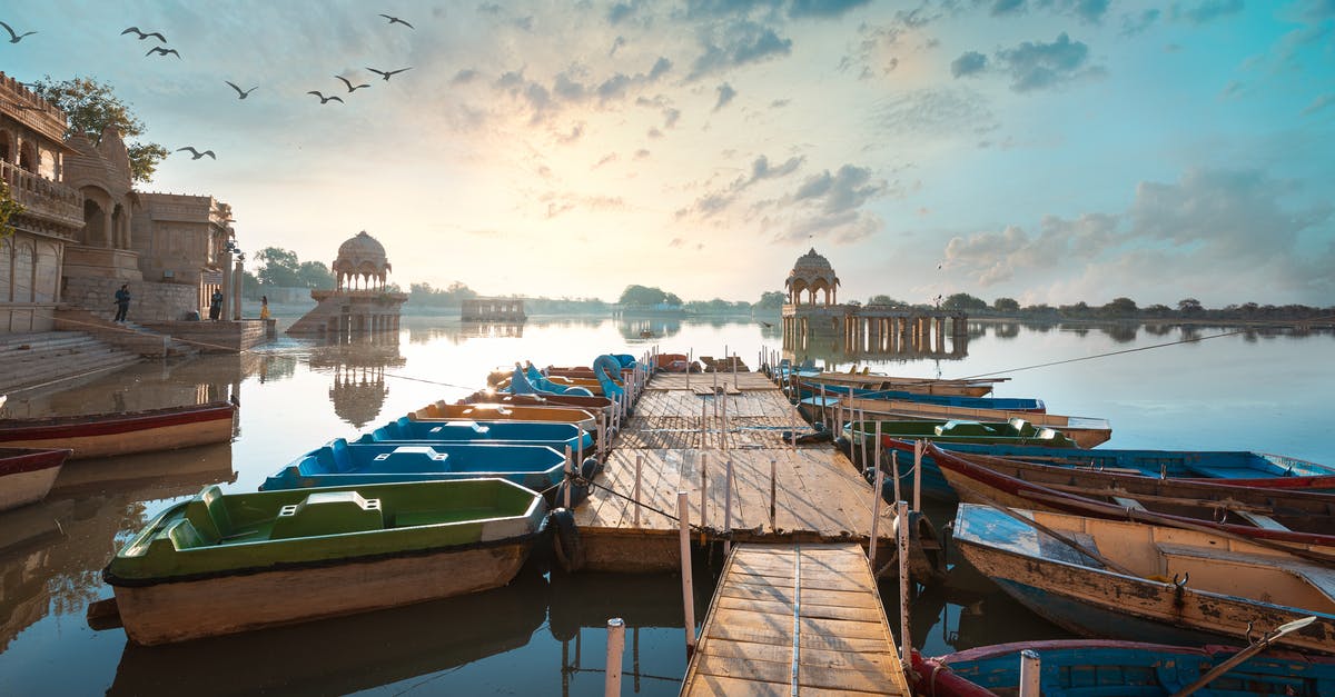 Places in India where no vehicles are allowed - Colorful Boats On Wooden Dock 