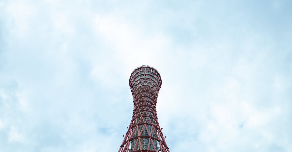 Places with unusual platform numbers - Tall observation sightseeing tower against clouds