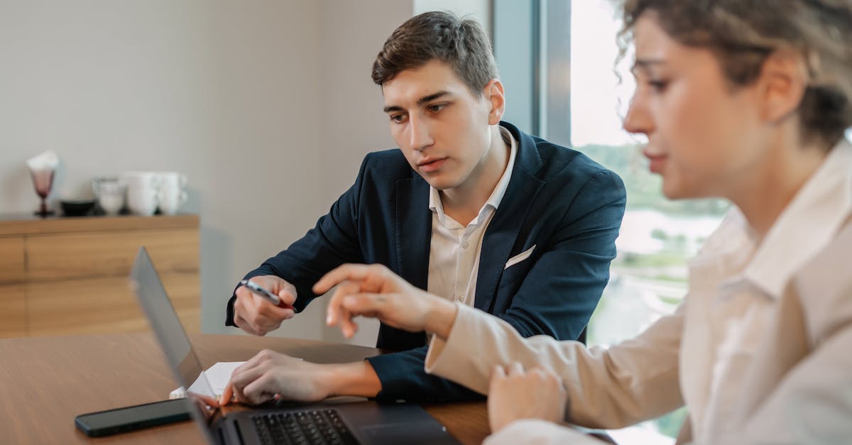 Planning a cruise - Man in Black Blazer Using Laptop Computer