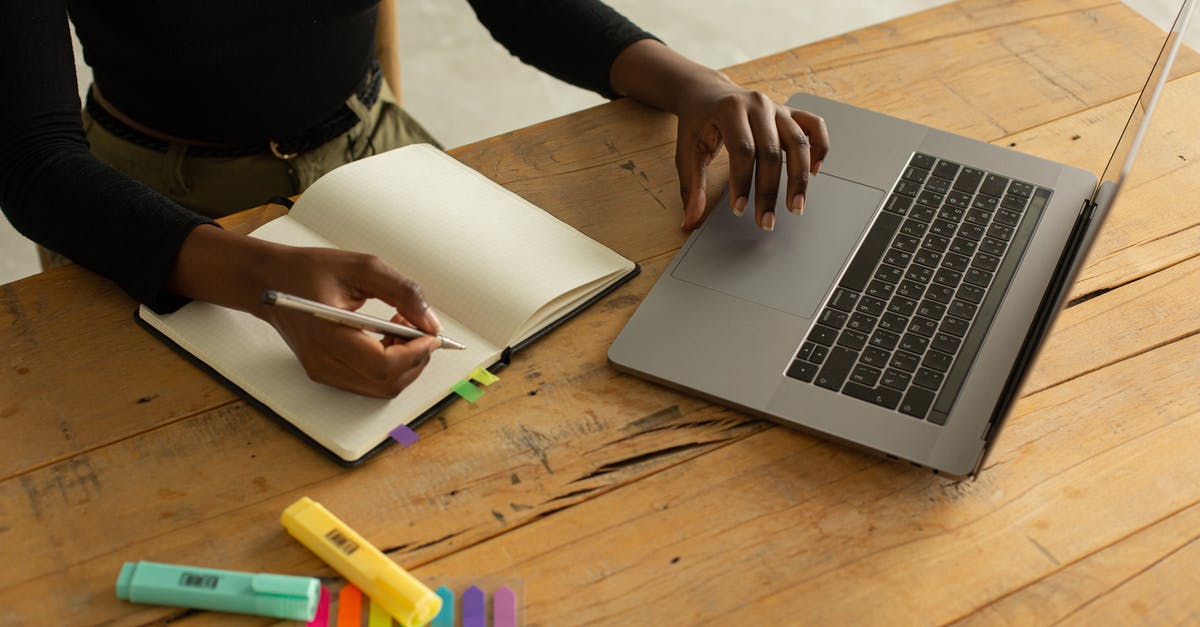 Planning flights - broad connection flights search engine? [duplicate] - From above of crop black anonymous female freelancer sitting at table with opened laptop and notebook with markers and bookmarks and working remotely