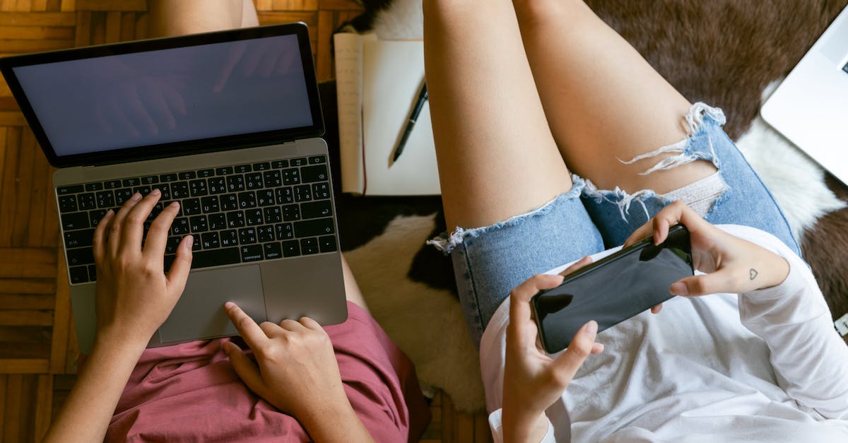 Planning flights - broad connection flights search engine? [duplicate] - From above of crop girlfriends in home clothes sitting on floor with laptop and smartphone while spending time together and planning weekend