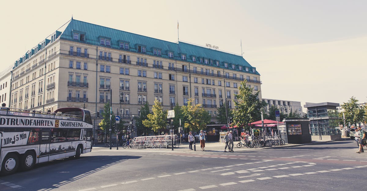 Planning to stay for 3 months in Berlin, Germany. Should I bring a car with me? - People Walking on Sidewalk Near Building
