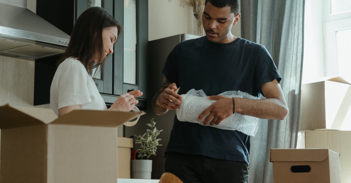 Plastic boxes on easyjet? - Man in Blue Crew Neck T-shirt Holding Woman in White Long Sleeve Shirt