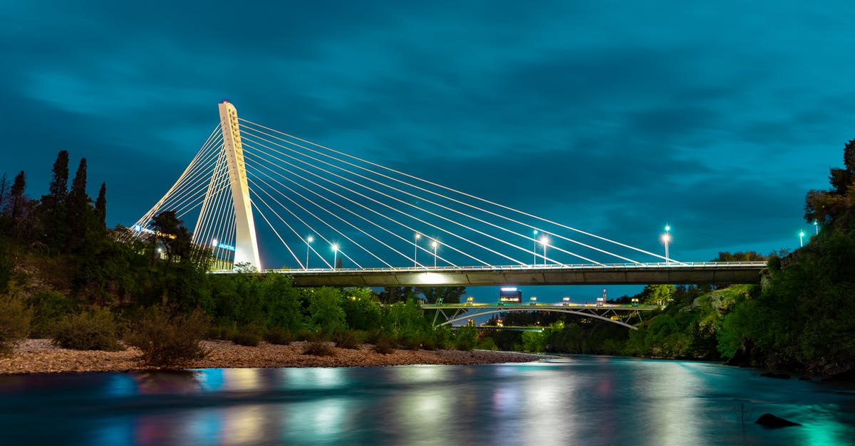 Podgorica, Montenegro to Tirana, Albania by public transport - Bridge over calm reflected river surface