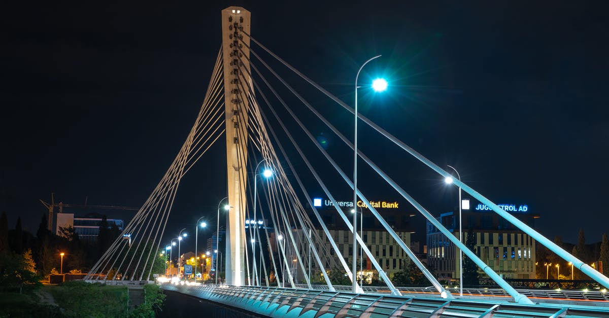 Podgorica, Montenegro to Tirana, Albania by public transport - Illuminated contemporary bridge at night city